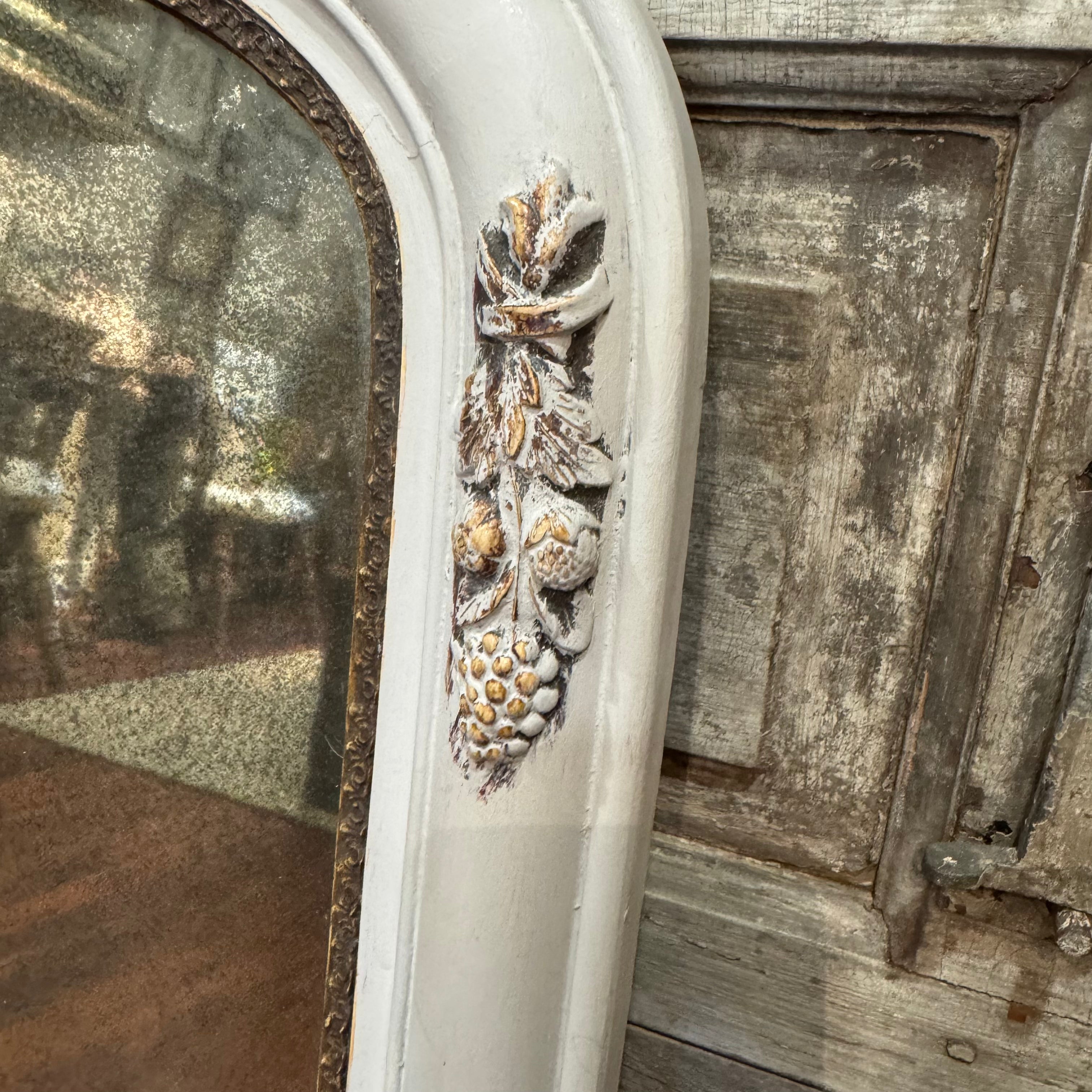 Vintage Arched Foxed Mirror With Acorn Motif