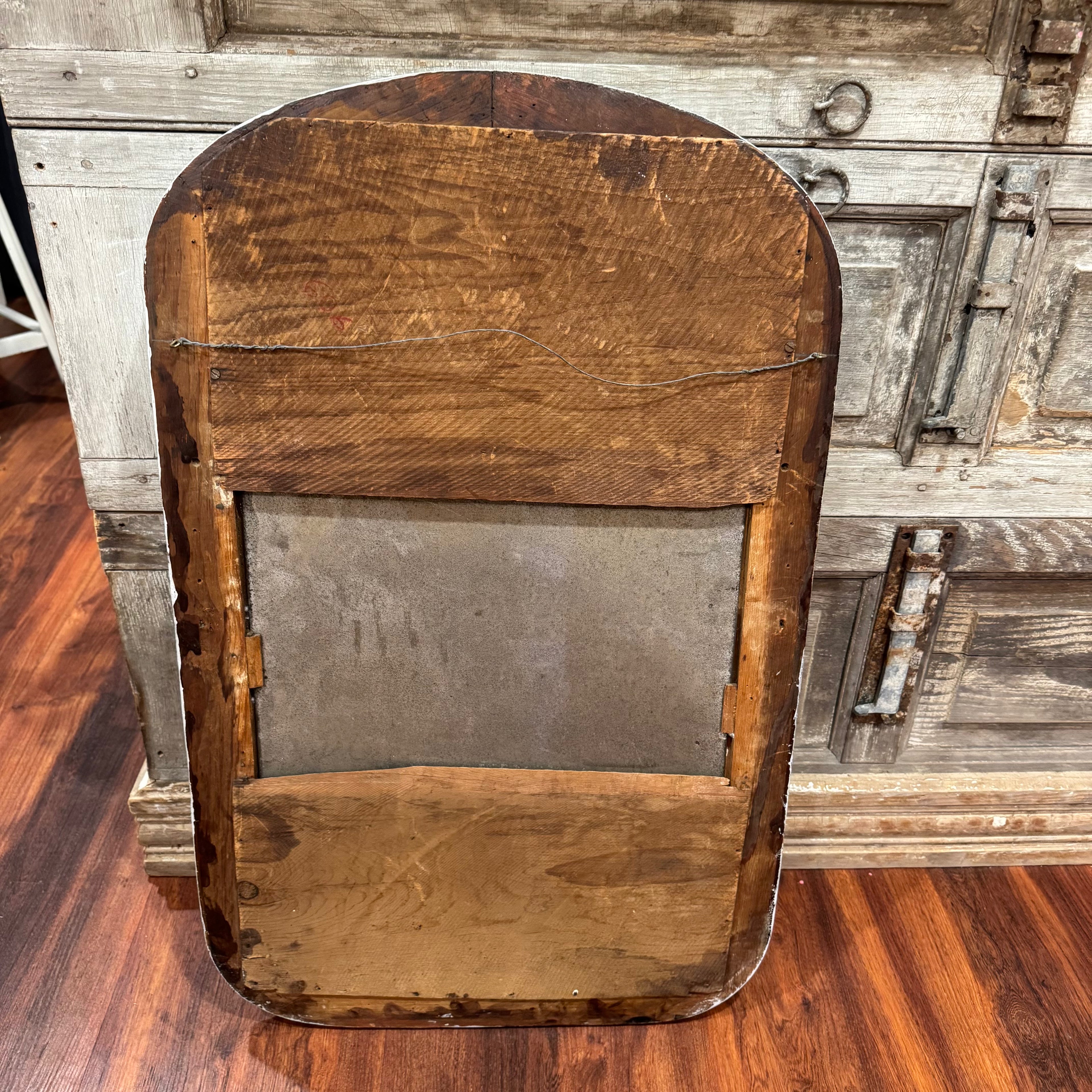 Vintage Arched Foxed Mirror With Acorn Motif